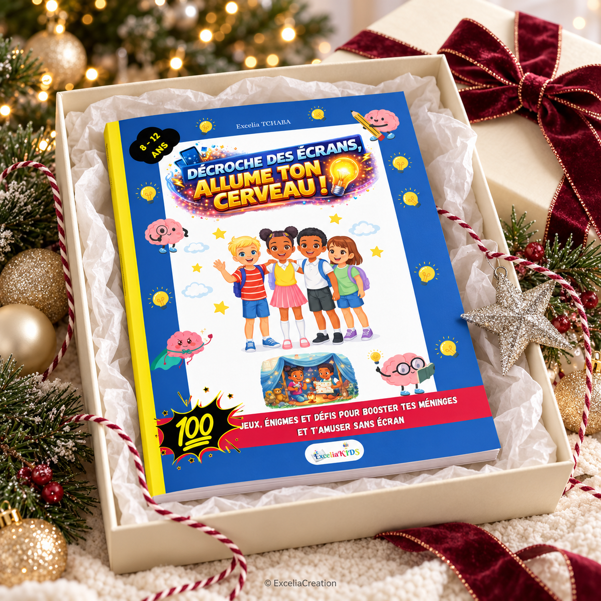 Idée cadeau Noël : livre en coffret crème ouvert, accessoires de mise en scène